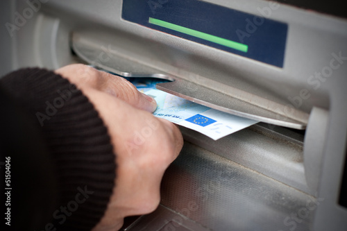 Photo: Getting cash at ATM machine Getting cash at ATM machine