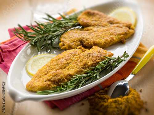 Photo: escalope with curry spice, selective focus escalope with curry spice, selective focus