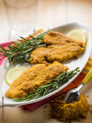 Photo: escalope with curry spice, selective focus escalope with curry spice, selective focus