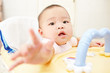 Baby reaching to camera