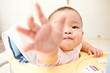 Baby reaching to camera