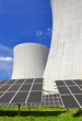 Solar energy panels before a nuclear power plant