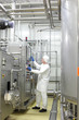 Technician controlling industrial process