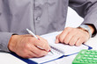 Hand with a pen.