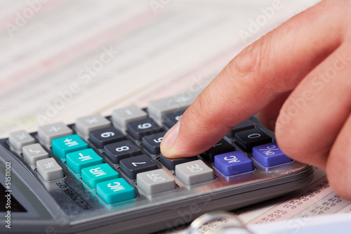 Photo: Hand with calculator. Hand with calculator.