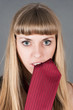 beautiful woman holds in teeth tie
