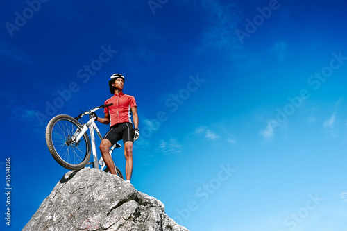 Photo: confident mountain bike man celebrating confident mountain bike man celebrating