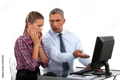 Photo: Employee having trouble with computer Employee having trouble with computer