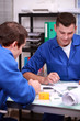 Two warehouse managers checking stock