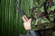 Soldier holding rifle AK-47