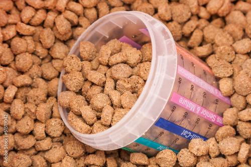 Photo: dry grained pets food with measured glass dry grained pets food with measured glass