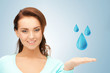 woman showing blue water drops