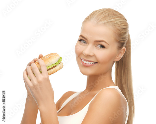 Photo: woman eating junk food woman eating junk food