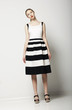 Elegant Woman Fashion Model in Light Striped Cotton Sundress