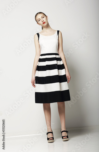 Photo: Elegant Woman Fashion Model in Light Striped Cotton Sundress Elegant Woman Fashion Model in Light Striped Cotton Sundress