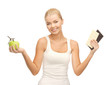 Photo: sporty woman with apple and chocolate bars sporty woman with apple and chocolate bars