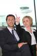 Foto: Businessman and woman pointing Businessman and woman pointing