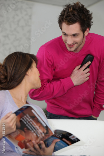 Photo: Couple at home with a telephone Couple at home with a telephone