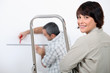 Couple decorating home
