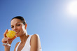 Woman enjoying fruit juice outdoors