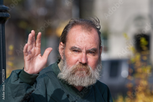Photo: Homeless man waving Homeless man waving