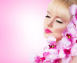 Pretty girl with flowers and perfect makeup