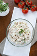 Smoked mackerel pate with eggs and herbs in glass bowl