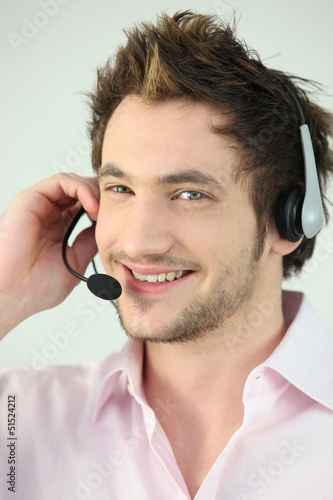 Photo: Cheerful call-center worker Cheerful call-center worker