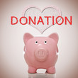 Piggy bank with heart and donation text