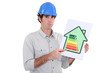 Photo: Man pointing to energy efficiency panel Man pointing to energy efficiency panel