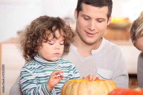 Photo: child emptying pumpkin child emptying pumpkin