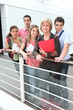 Photo: Teacher standing with students Teacher standing with students