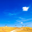 Cervantes Windmills blue sky and small cloud. Consuegra, Spain