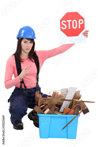 Photo: craftswoman holding a stop sign craftswoman holding a stop sign