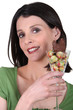 Foto: woman holding a glass with Easter chocolate eggs woman holding a glass with Easter chocolate eggs