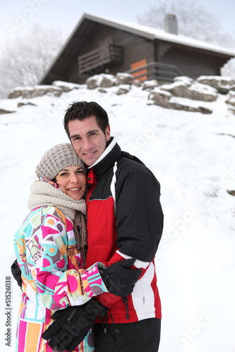 Photo: portrait of young couple at ski resort portrait of young couple at ski resort