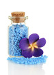 Little bottle full with colorful beads isolated on white