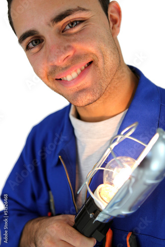 Photo: Electrician holding lamp Electrician holding lamp