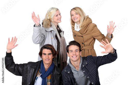 Photo: two young couples posing together two young couples posing together
