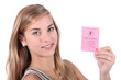 Teenager showing driving licence