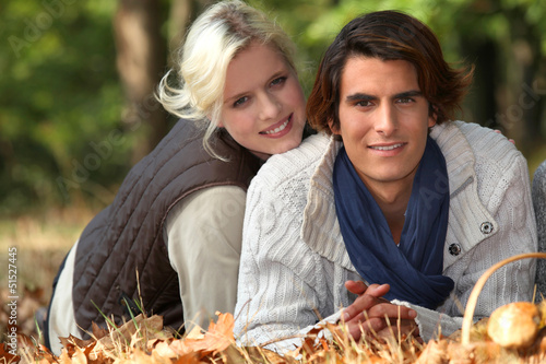 Photo: Couple laid in the woods Couple laid in the woods