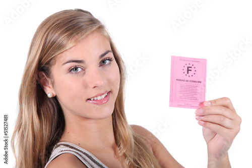 Photo: Teenager showing driving licence Teenager showing driving licence