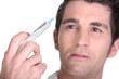 Photo: Man with syringe in hand Man with syringe in hand