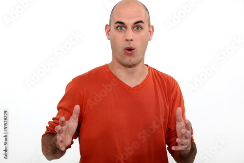 Photo: bald man open-mouthed in surprise bald man open-mouthed in surprise