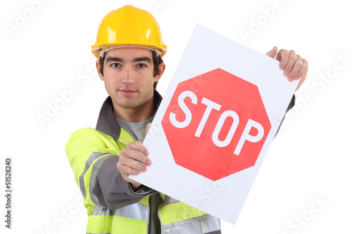 Photo: A young road worker. A young road worker.