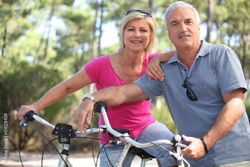 Photo: Couple enjoying a bike ride Couple enjoying a bike ride
