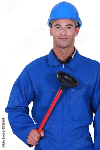 Photo: Plumber holding a plunger Plumber holding a plunger