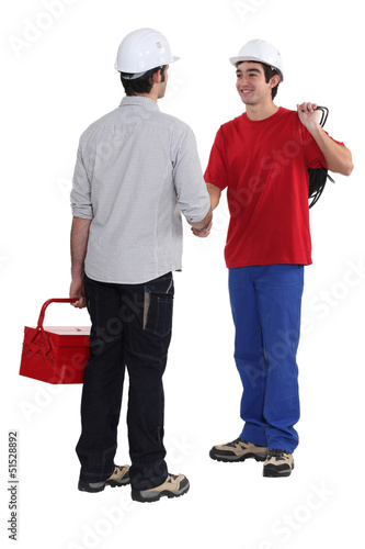 Photo: Tradesman welcoming a new recruit Tradesman welcoming a new recruit
