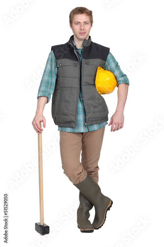 Photo: Man stood with sledge hammer Man stood with sledge hammer