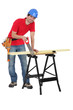 Man sawing plank of wood